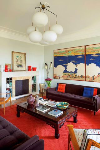 Japanese silk screen from the Taishō period (right wall), a sofa designed by Meroni, an antique Chinese coffee table, an armchair with upholstery designed by Gio Ponti