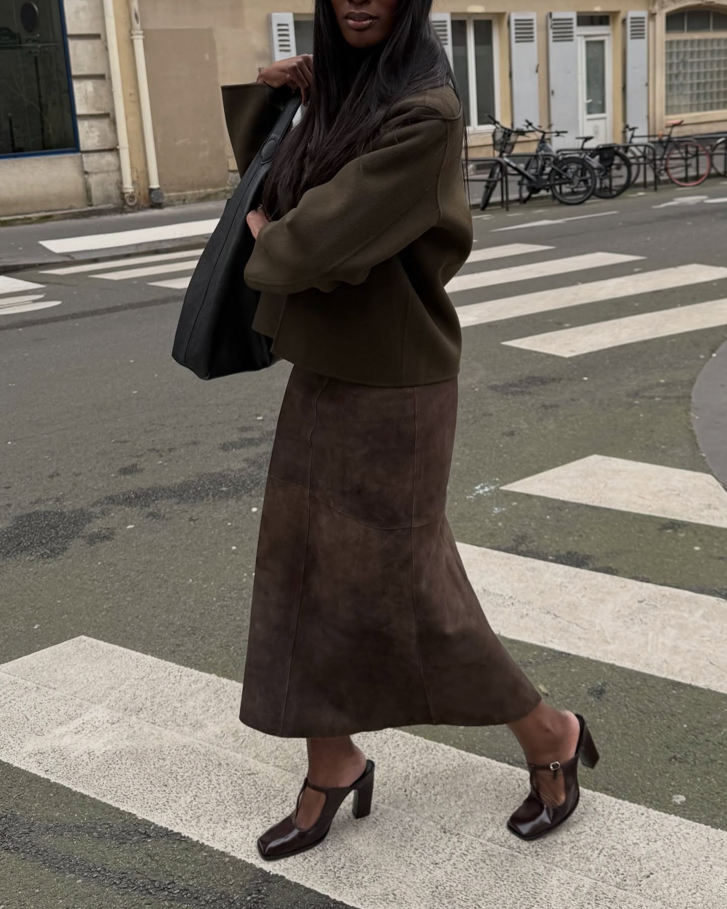 Creator @_livmadeline wearing a suede outfit in Paris