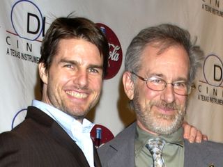 Tom Cruise poses with a friend on the red carpet