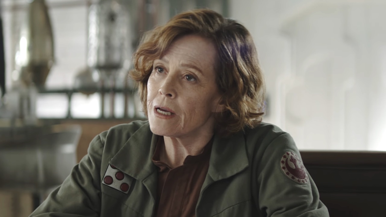 Colonel Ward sitting at table talking to Din Djarin in The Mandalorian and Grogu