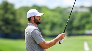 Scottie Scheffler checks his golf grip