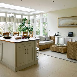 kitchen diner in edwardian home with wicker furniture