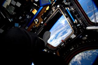 Scott Kelly's Toe Points Out the Moon