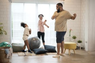 Man with children exercising at home