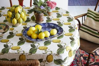 A lemon print table cloth with lemon motif ceramic