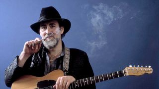 Roy Buchanan smoking a cigar