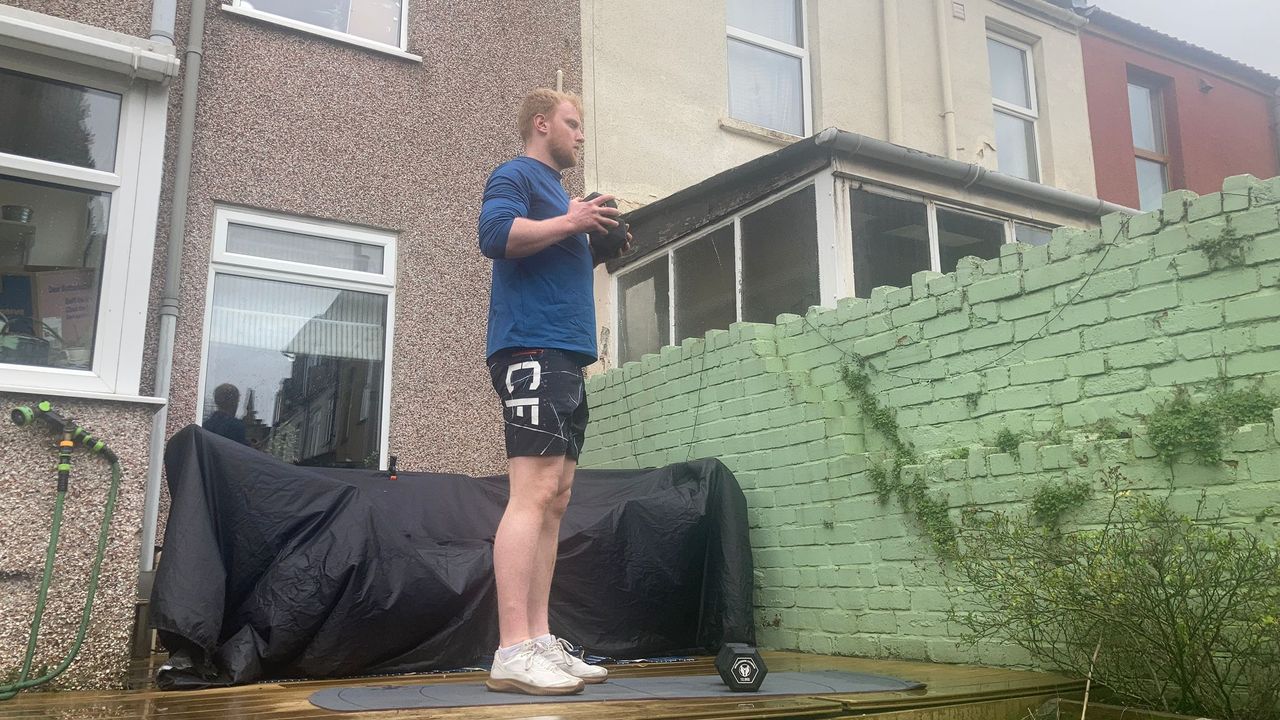 Fit&amp;Well fitness writer Harry Bullmore demonstrating a standing chest press