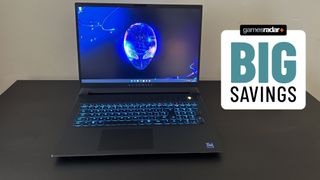 Alienware M18 gaming laptop on a black table with big savings badge