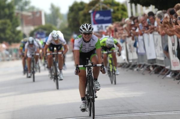 Annemiek Van Vleuten (Nederland Bloeit) finally relaxed to enjoy her win as she crossed the line.