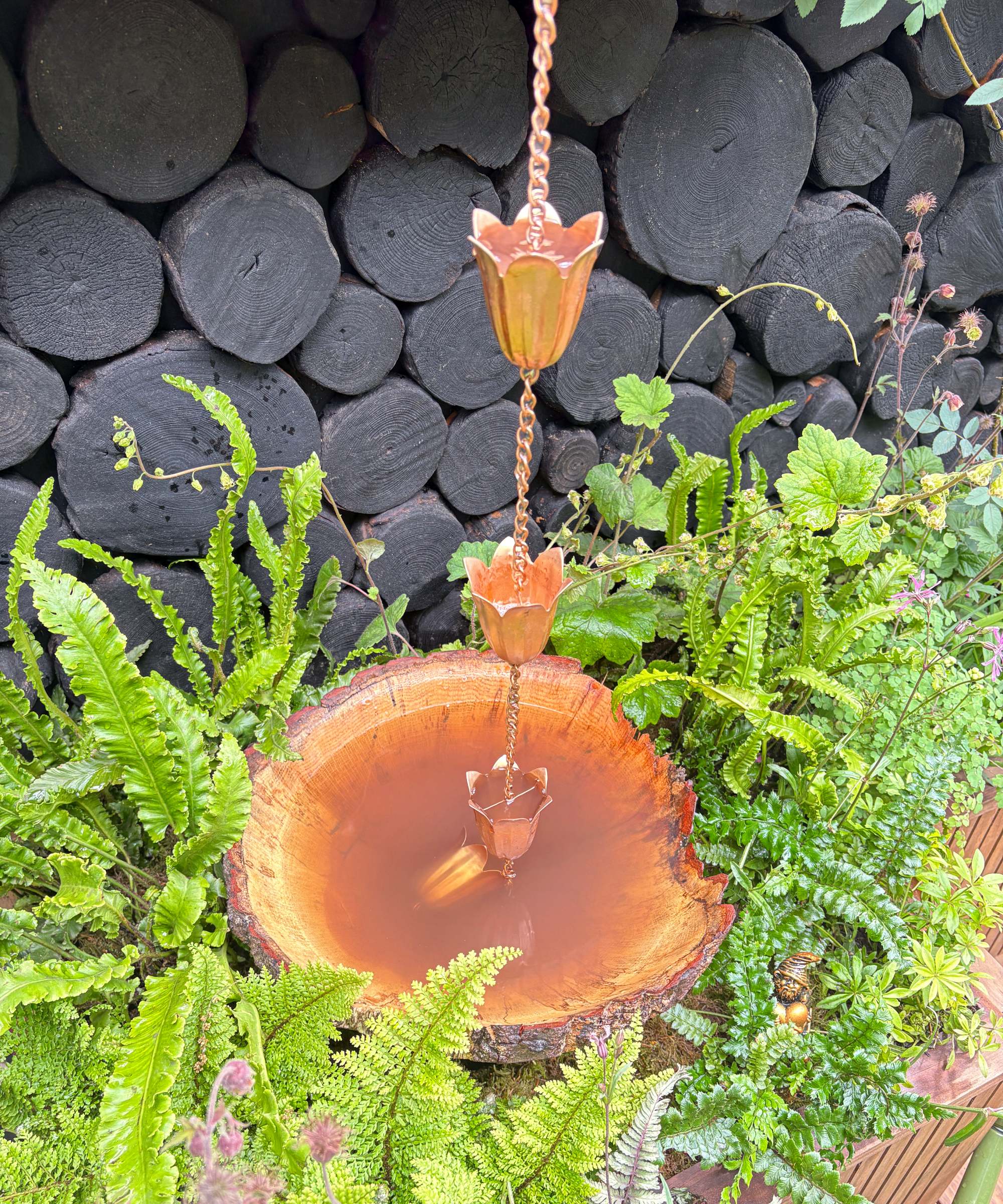 rain chain made of copper in a show garden at RHS Chelsea Flower Show 2026
