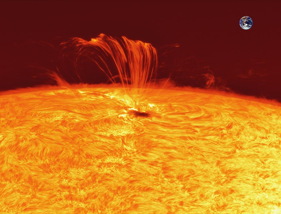 French skywatcher Jean-Pierre Brahic took this photo of the violent solar flare from the sunspot 1302 on the sun&#039;s surface on Sept. 22, 2011. Earth is superimposed for scale. 