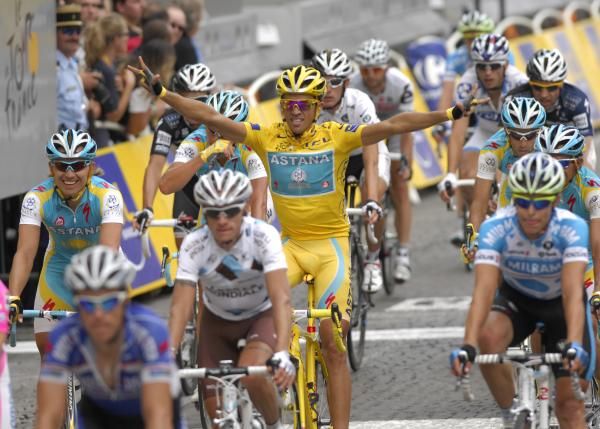 Alberto Contador (Astana) crosses the line on the Champs-Elysees