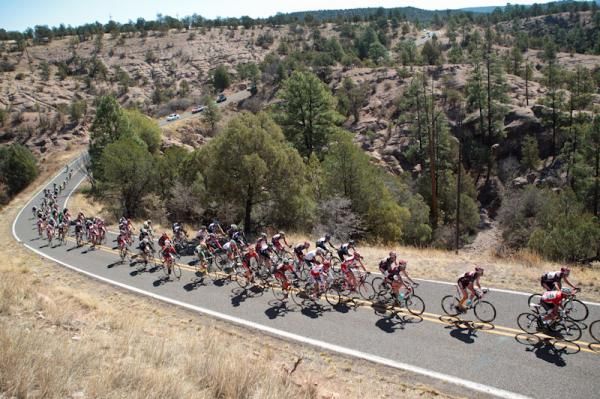 The men's peloton rolling through the New Mexico countryside.