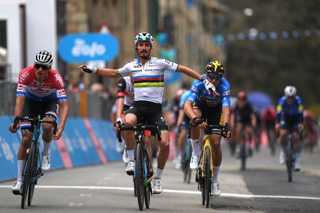 CHIUSDINO ITALY MARCH 11 Arrival Mathieu Van Der Poel of Netherlands and Team AlpecinFenix Julian Alaphilippe of France and Team Deceuninck QuickStep Celebration Wout Van Aert of Belgium and Team Jumbo Visma Blue Leader Jersey during the 56th TirrenoAdriatico 2021 Stage 2 a 202km stage from Camaiore to Chiusdino 522m TirrenoAdriatico on March 11 2021 in Chiusdino Italy Photo by Tim de WaeleGetty Images