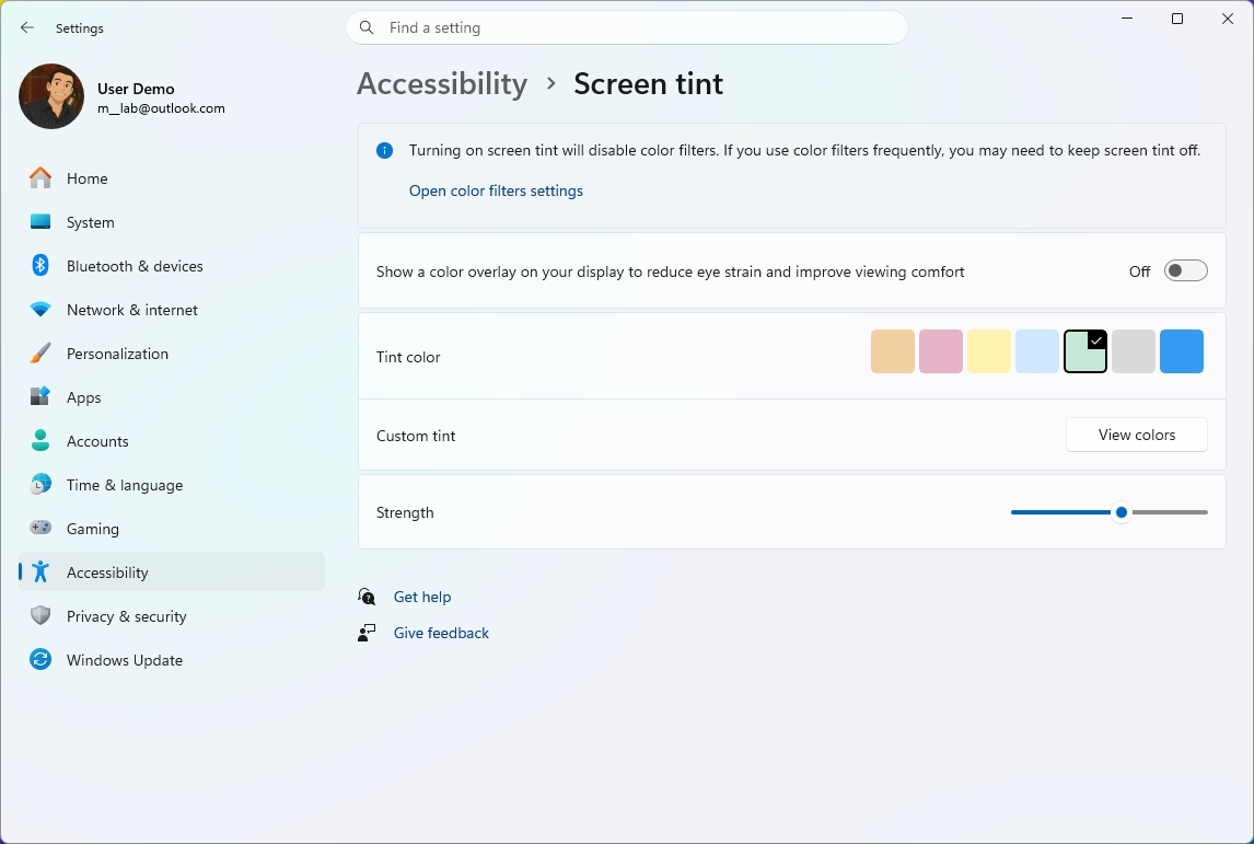 Windows 11 Accessibility settings open to Screen tint options, showing color choices, custom tint, and a slider to adjust strength.