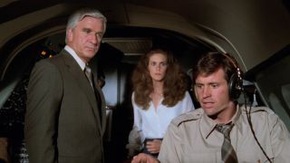 From left to right, Dr. Rumack, Elaine and Ted in the cockpit of the plane.