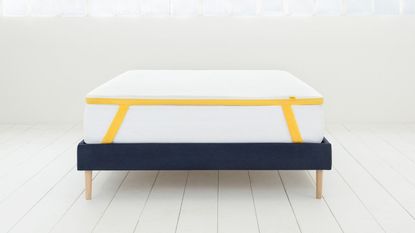 best mattress topper: Eve mattress topper on a mattress in a sunlit room