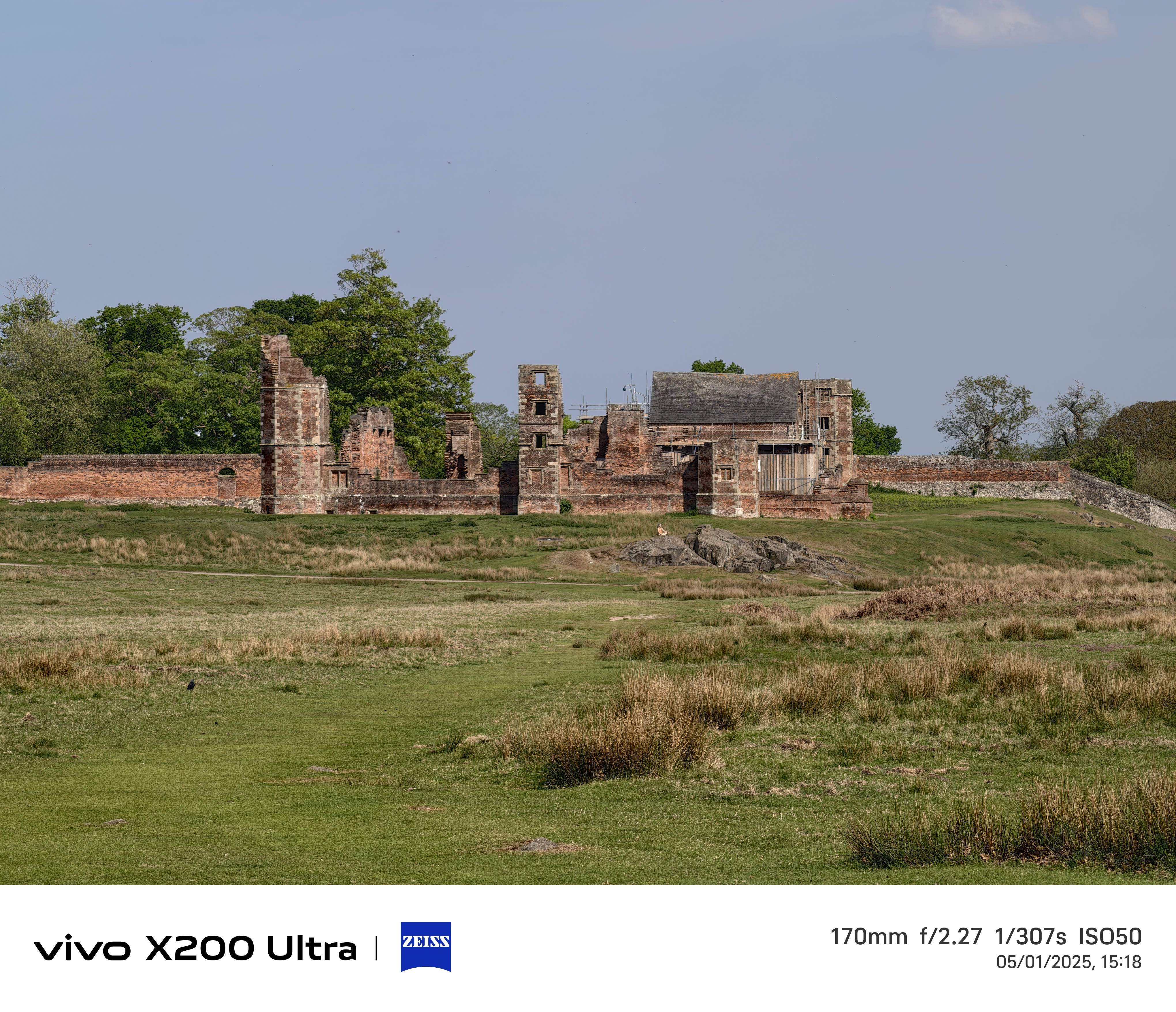 Old ruins in the distance across a field