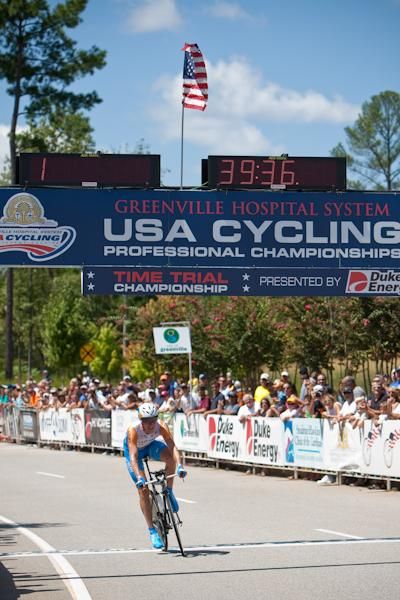 Tom Zirbel (Bissell) gets his photo taken by a fan as he crosses the finish.