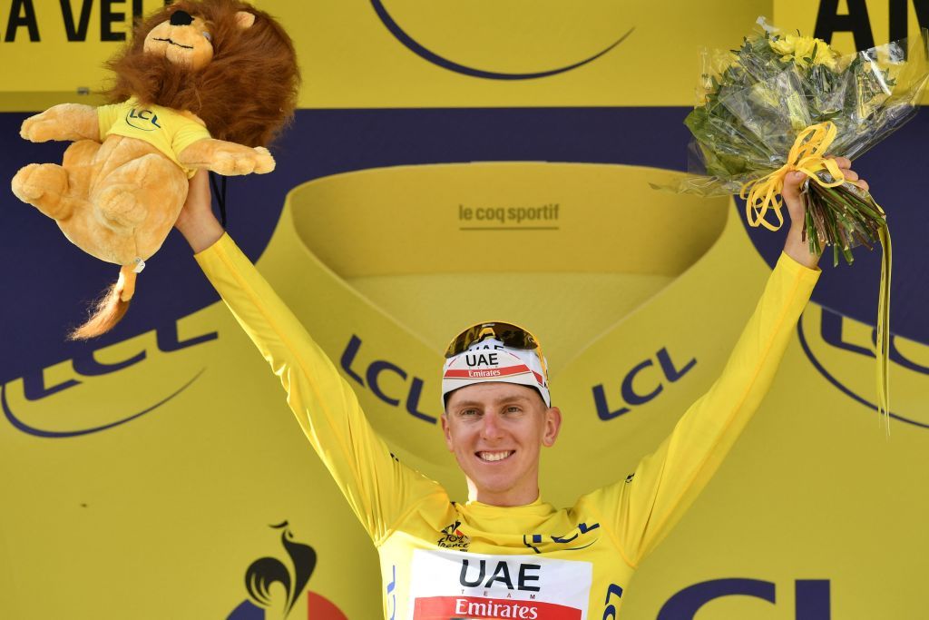 Team UAE Emirates Tadej Pogacar of Slovenia celebrates his overall leader yellow jersey on the podium at the end of the 15th stage of the 108th edition of the Tour de France cycling race 191 km between Ceret and AndorreLaVieille on July 11 2021 Photo by Philippe LOPEZ AFP Photo by PHILIPPE LOPEZAFP via Getty Images