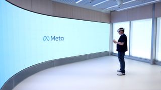 Meta employee Dennis Hampton prepares to demonstrate a video game that is played using the Oculus Quest 2 virtual reality headset at the new Meta Store on May 04, 2022 in Burlingame, California.