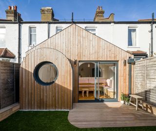 small timber clad extension to white house