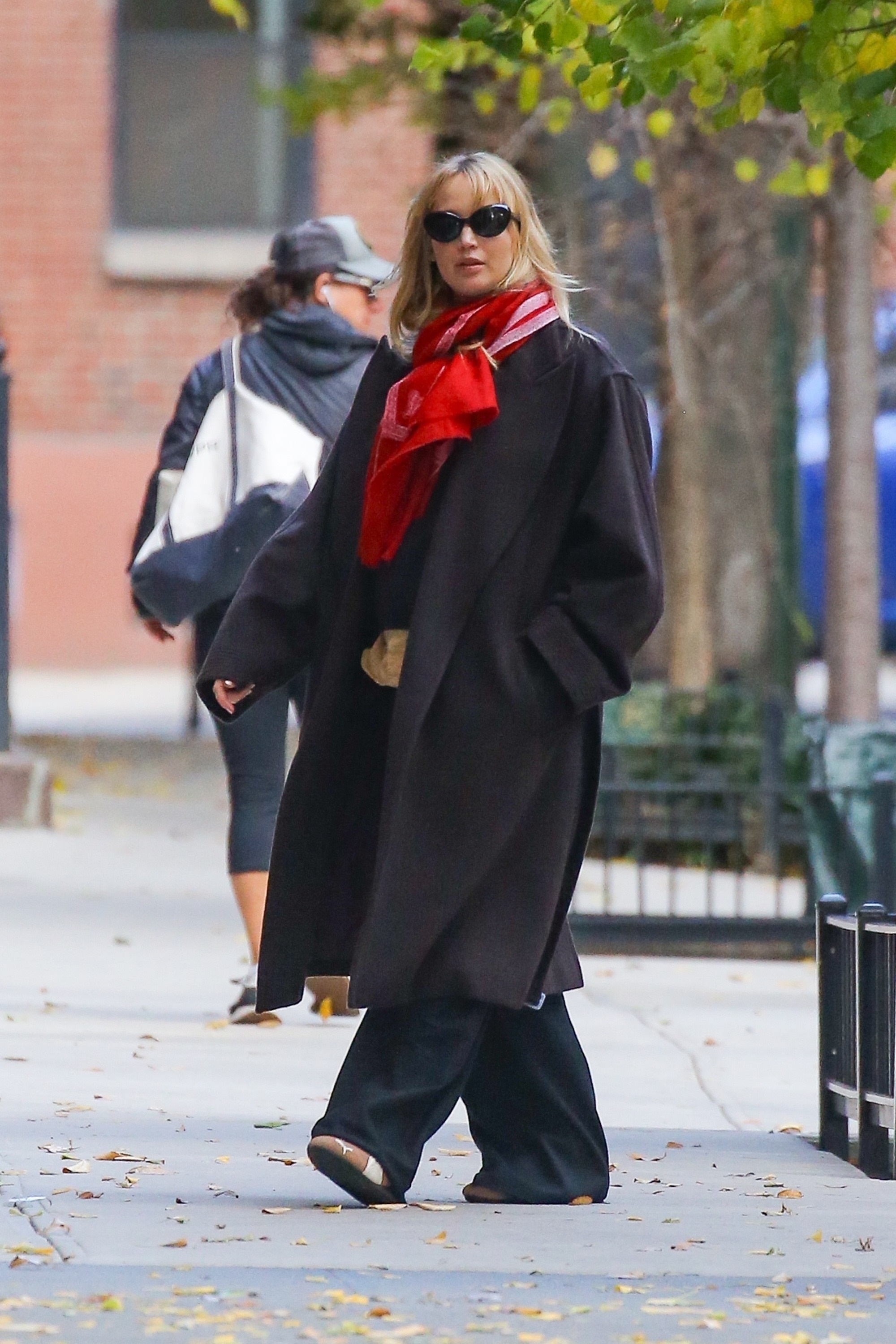 Jennifer Lawrence wears Puma Speedcat sneakers while pregnant.