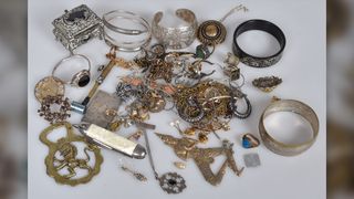 The ring is just visible here near the center of the jewelry bundle. Archaeologists have tracked the items to a man who said he&#039;d bought them at an antique shop in Norway.