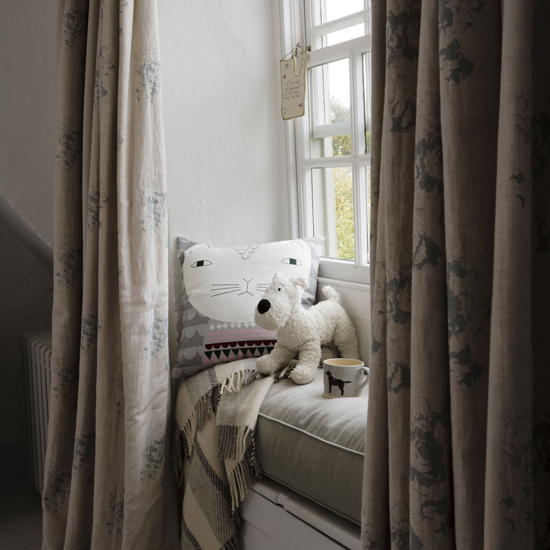 white window couch with cushion
