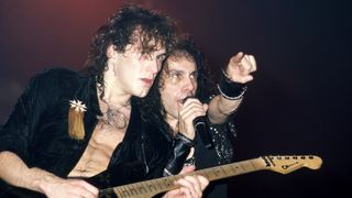 Northern Irish guitarist Vivian Campbell and American heavy metal singer Ronnie James Dio (1942 - 2010), of the American heavy metal band Dio, perform on stage during the 1985 Sacred Heart tour at the Cobo Arena in Detroit, Michigan, November 2, 1985
