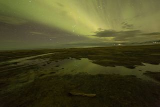 Aurora reflected in water works well if there’s a weak display. Image: Jamie Carter