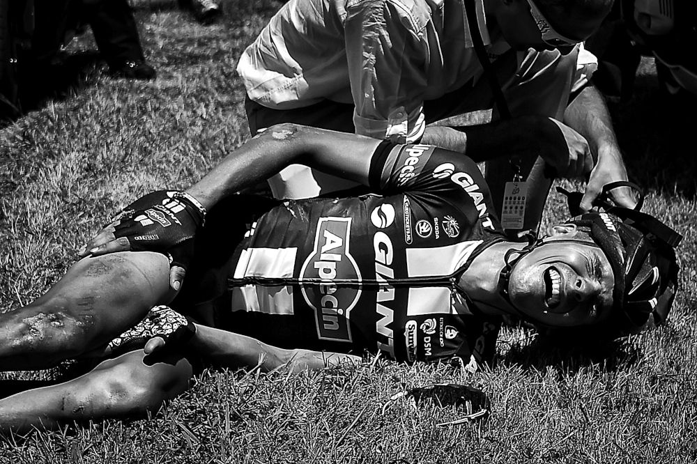 Warren Barguil grimaces after a fall during the 10th stage of the 2015 Tour de France