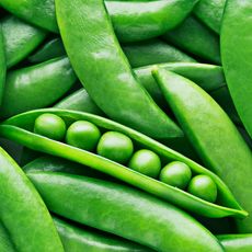 very close up of ripe green peas and pods 