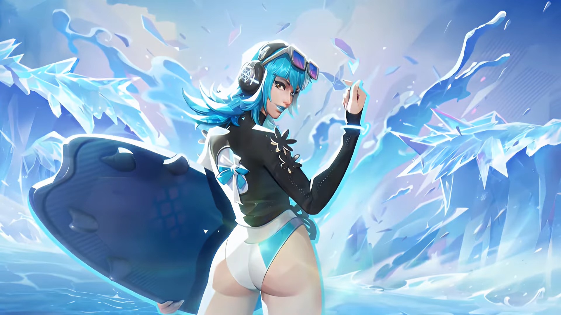 Luna Snow holds a surf board and poses as waves crash in the background