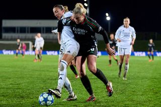  Sheila Garcia of Real Madrid CF battle for the ball with Alessia Russo of Arsenal FC during the UEFA Women's Champions League Quarter Finals First Leg match between Real Madrid CF and Arsenal FC at Estadio Alfredo Di Stefano on March 18, 2025 in Madrid, Spain.