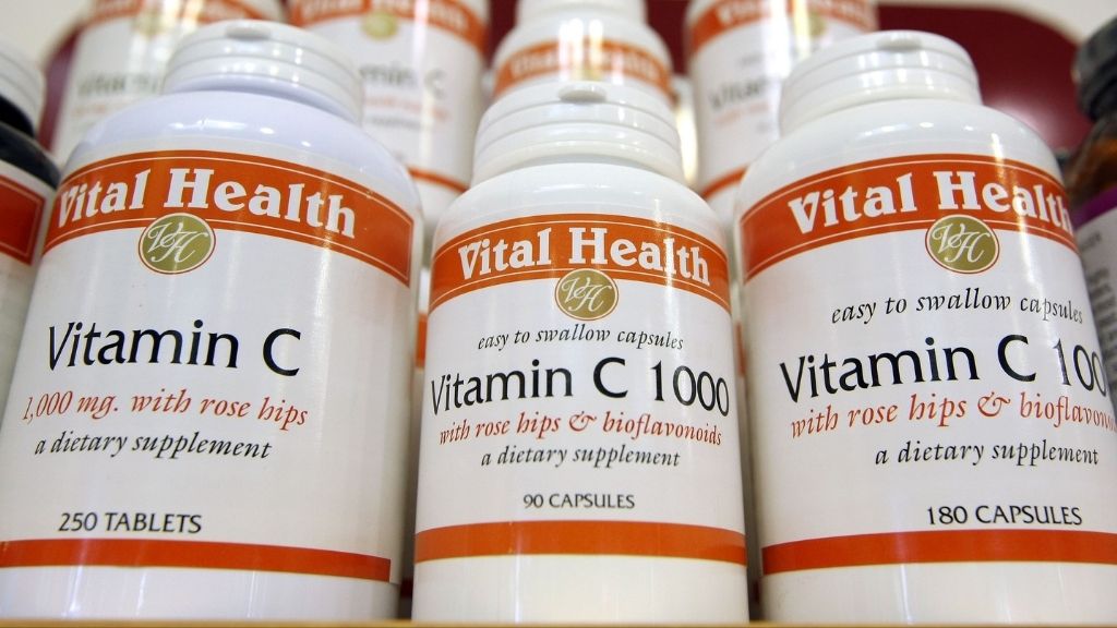 vitamin c supplement bottles lined up on a shelf