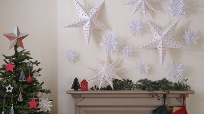 A Christmas foliage arrangement with DIY decorations made from tomato paste tube