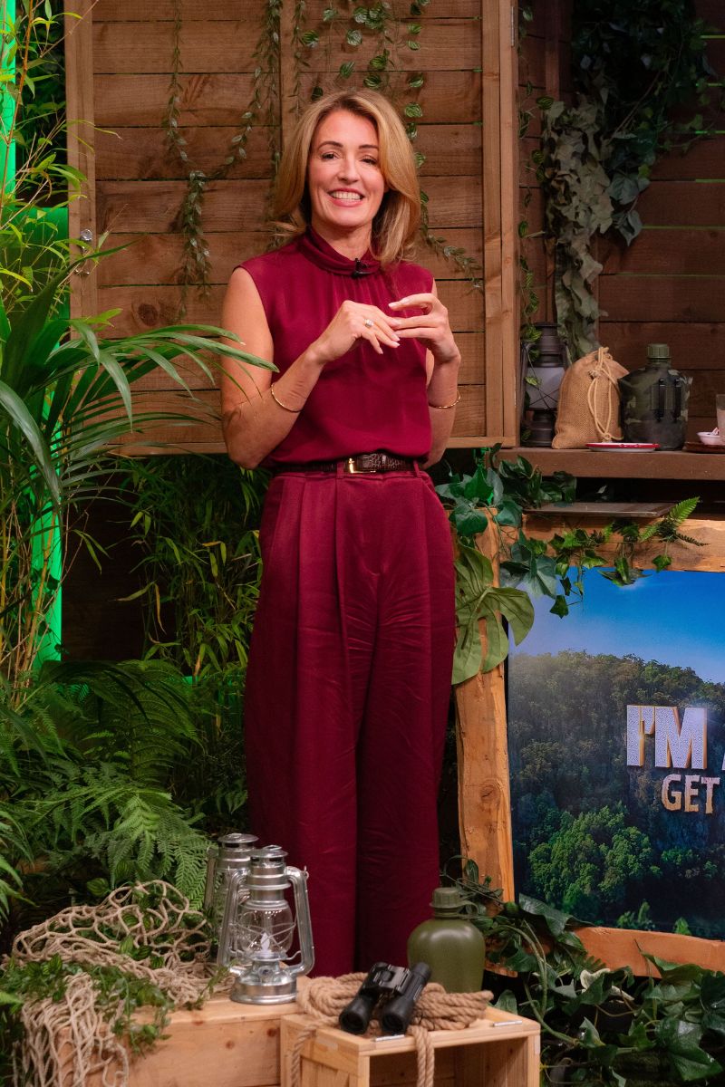 Cat Deeley on the set of This Morning in a merlot-hued jumpsuit with scarf neck