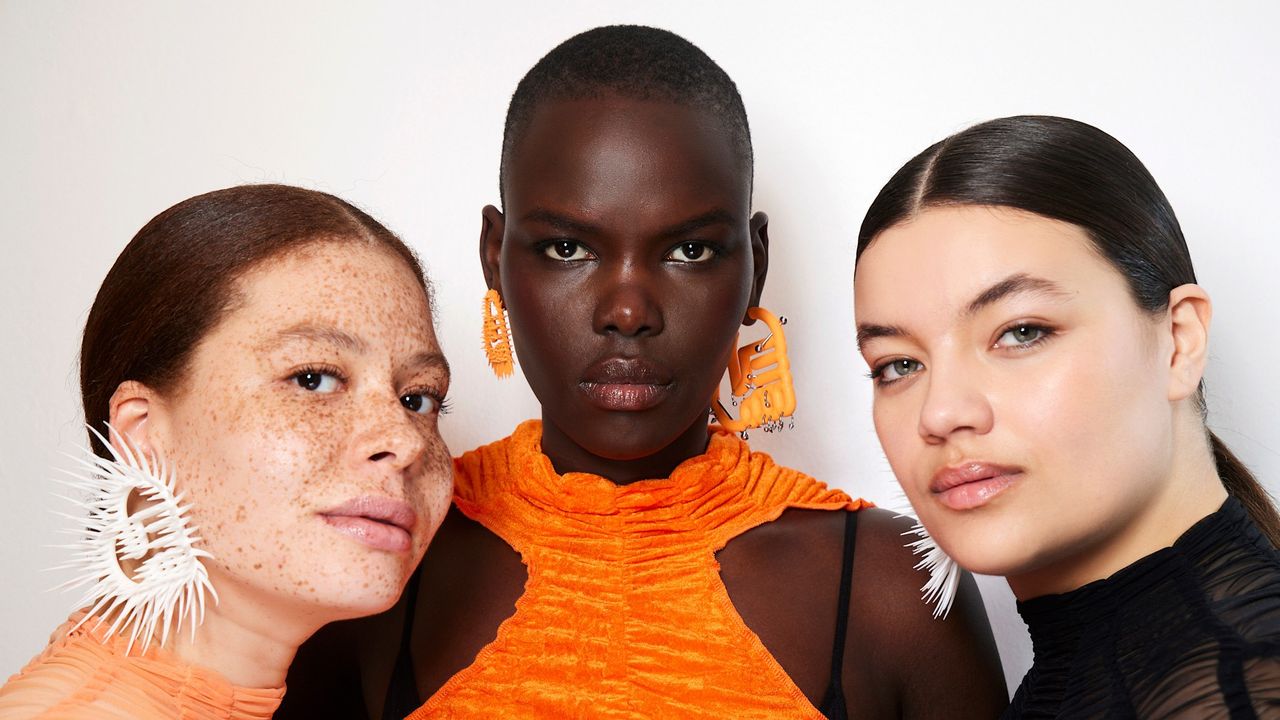 women in orange and white wearing jasmine perfume