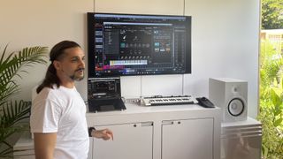 A musician shows off a Cubase digital audio workstation setup running natively on a Snapdragon X Elite-powered Copilot Plus laptop