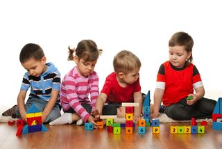 Preschool children play with educational toys.