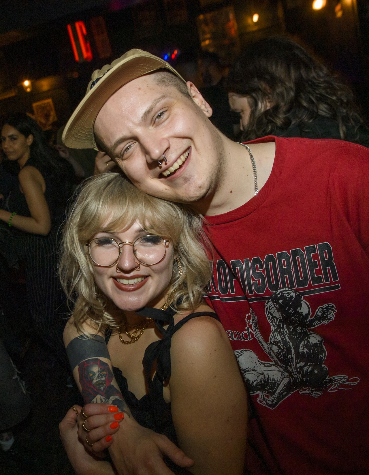 Two people smiling and hugging