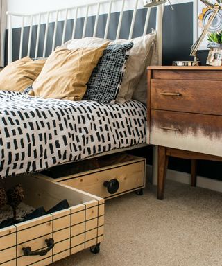 DIY under bed storage boxes with graphic grid detailing, and assorted drawer knobs.
