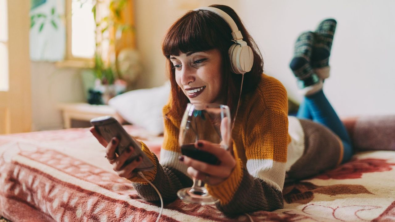 Woman on Video Call Drinking Wine