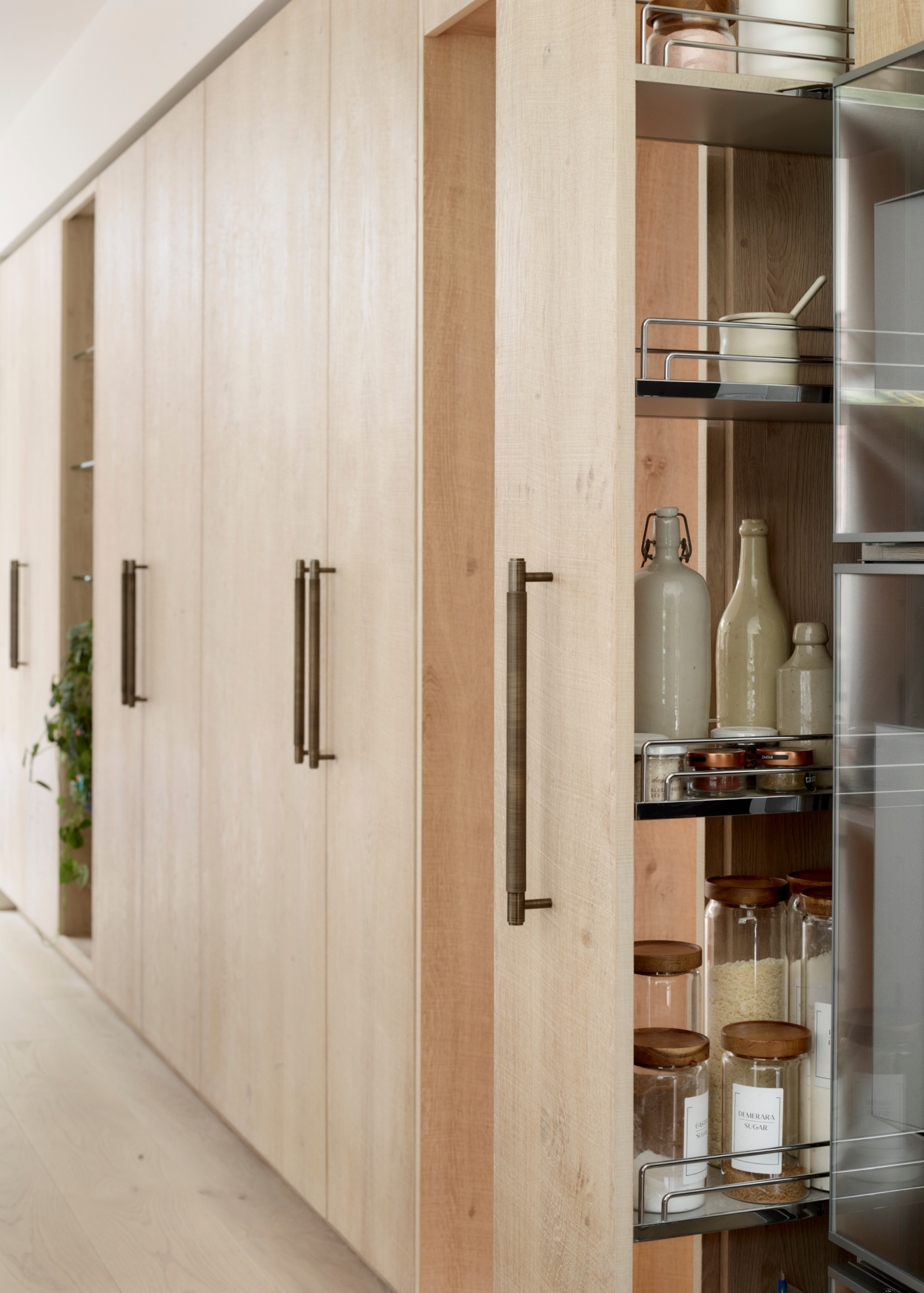 wooden pocket door storage in a large kitchen