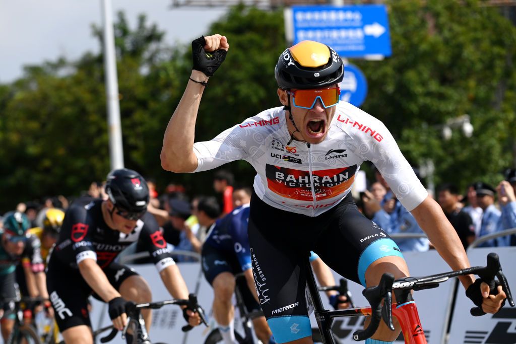 QINZHOU CHINA OCTOBER 13 Jonathan Milan of Italy and Team Bahrain Victorious White best young jersey celebrates at finish line as stage winner during the 4th GreeTour of Guangxi 2023 Stage 2 a 1496km stage from Beihai to Qinzhou UCIWT on October 13 2023 in Qinzhou China Photo by Tim de WaeleGetty Images