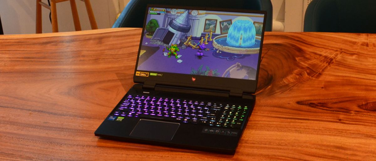 An Acer Predator Helios 300 (2022) sitting on a wooden table in a commissary