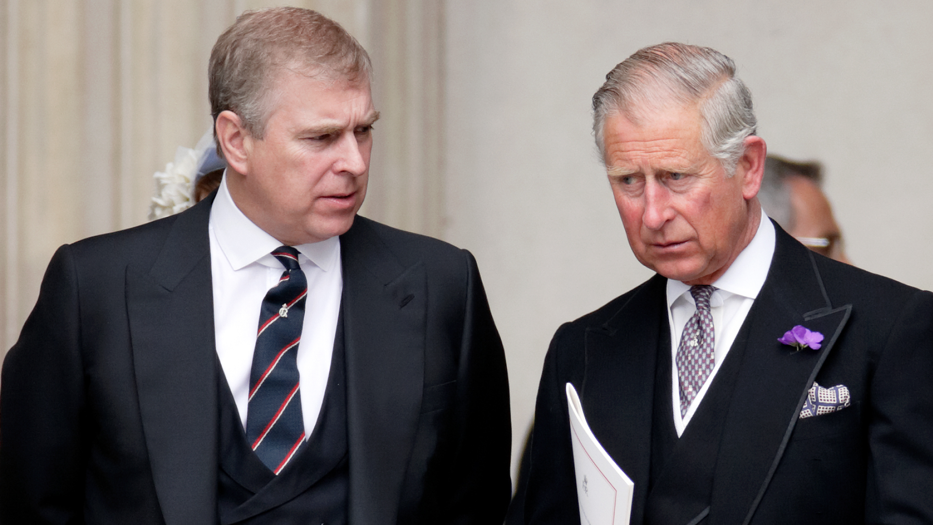 Prince Andrew and The King wearing black suits