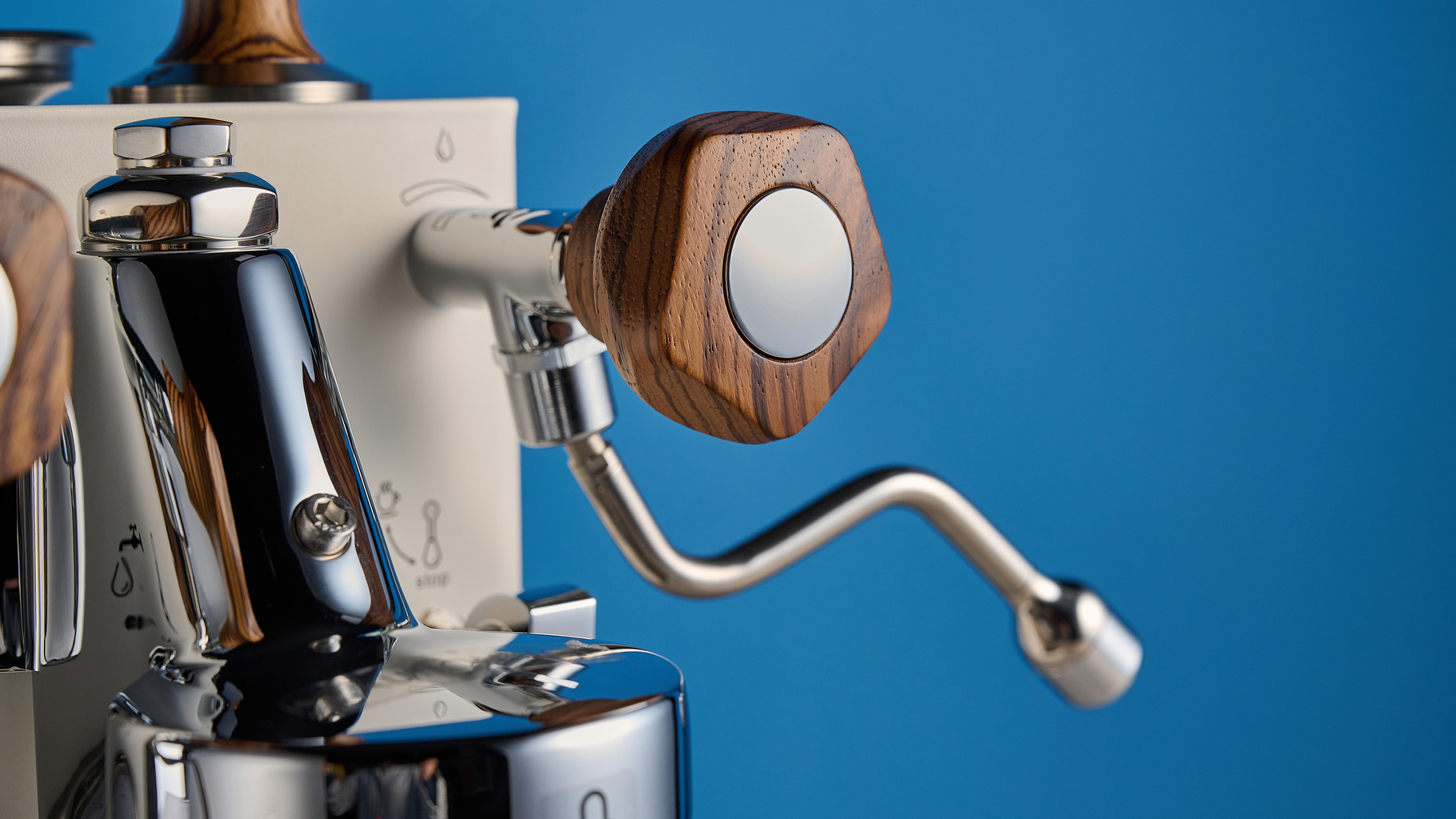 the lelit mara x3 in white and walnut photographed against a blue tom's guide background