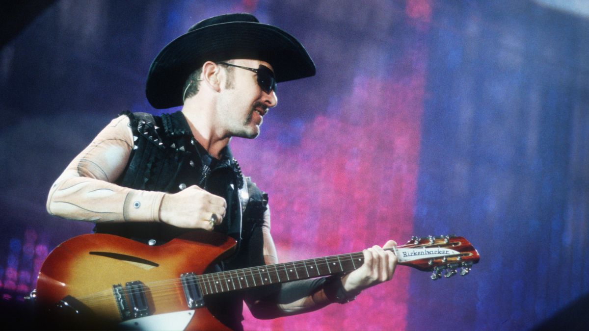 U2 in costumes designed by Walter Van Beirendonck, The Edge, Werchter Festival Grounds, Werchter, Belgium, 25 July 1997